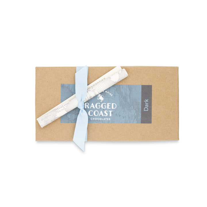 Dark Chocolate Truffle Assortment with a blue ribbon and branded packaging, encased in recyclable paperboard boxes by Ragged Coast Chocolates.