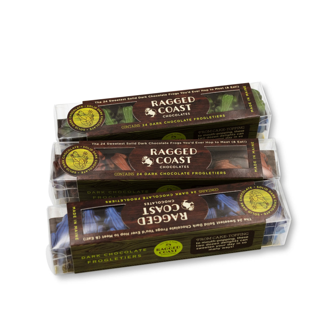 Stacked Ragged Coast Frogletiers with packaging showing the brand name "ragged coast chocolates" and indicating that they contain 24 vegan dark chocolate truffles.