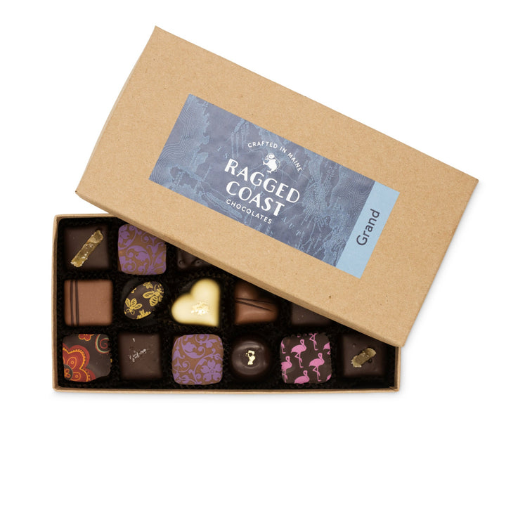 An open box of Grand Assortment of Milk and Dark Chocolate Truffles from Ragged Coast Chocolates.