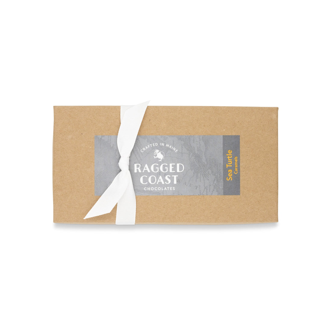 Elegant Sea Turtle Caramels box with white ribbon and Ragged Coast Chocolates branded label.