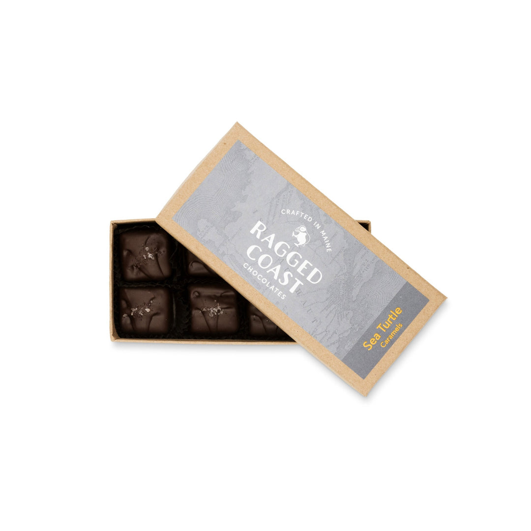 Box of Ragged Coast Chocolates Sea Turtle Caramels, featuring dark chocolate sea salt caramels with four pieces visible against a white background.