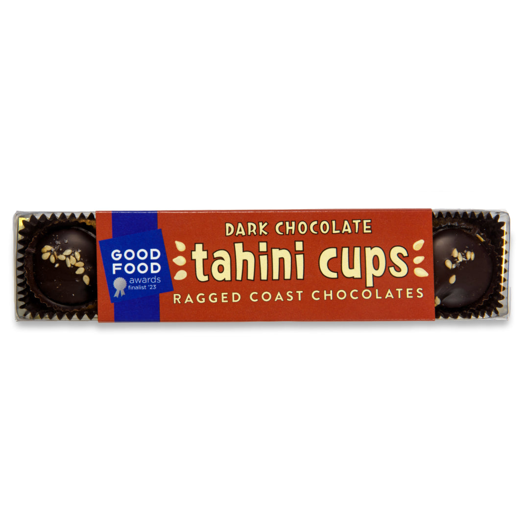 Package of Ragged Coast Chocolates' dairy-free Dark Chocolate Tahini Cups with two visible pieces and an award badge.