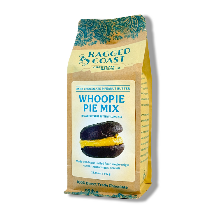 A bag of Ragged Coast Chocolates' Dark Chocolate and Peanut Butter Whoopie Pie Mix, with an image of two chocolate whoopie pies filled with peanut butter. The tan bag has blue and yellow accents and highlights this unique mix.